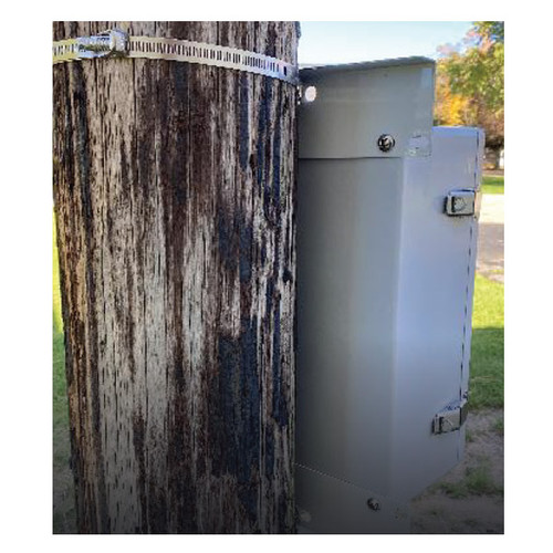 A PMJ6-8 Pole Mount Kit securing a gray metal box to a wooden utility pole.
