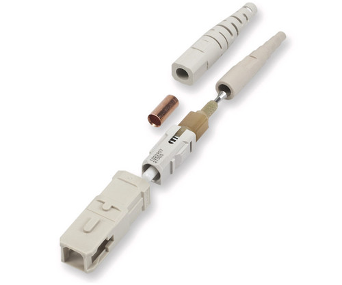 Disassembled SC fiber optic connector components with a boot, ferrule, and housing.