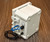 Gray rectangular plastic enclosure featuring a cable gland with a blue ethernet cable.