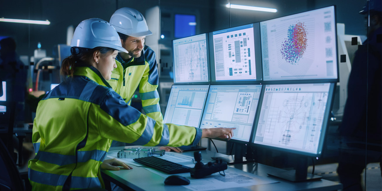 Industrial Network Engineers Viewing Monitors