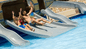 Family of day pass guests enjoying the water slide at Sonesta Maho Beach Resort in St. Maarten. 