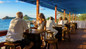 Day pass guests enjoying lunch at an outdoor restaurant at Bay Gardens Beach Resort in St. Lucia. 
