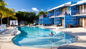 Pool and hotel at the True Blue Bay Boutique Resort