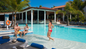 Unwind by the outdoor pools, sip a cocktail at the swim-up bar, or relax on the private beach with complimentary lounge chairs and towels.