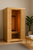 Hemlock infrared sauna in a minimalist wellness room with the ZenTherm™ Full-Body Red Light Therapy Panel glowing softly inside, shown through the open tempered glass door with a bench, towels, water bottle, and potted plant nearby.