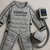 Zenova LymphoPress™ full-body compression massage suit laid flat with connected control unit on neutral background