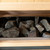 Traditional sauna stones stacked inside a sauna heater