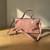 PAULIE SIGNATURE DUSTY ROSE HANDBAG

Soft Elegance. Everyday Confidence.
A beautiful statement bag designed for the woman who loves color, individuality,
and effortless style. Carry it by hand for a polished look or wear it with the longer strap for everyday comfort.

Elegant • Versatile • Distinctive
SHOP NOW — PAULIE ORGANIC CARE

It has two carrying options: a short top handle and a longer detachable/adjustable-looking strap,
so it can be presented as a convertible top-handle / shoulder bag. It also has a top zipper closure,
silver-tone hardware, visible stitching, and a relaxed but elegant shape.