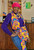 Paulie  UNITY HeadWrap # 001 

The size is about 70 x 20 inches, (180x 50 cm).
It gives full head coverage and is long enough and wide enough to tie any intricate style you like.

Unity can be a powerful force for positive change, as it allows individuals or groups
to pool their resources, ideas, and strengths to achieve a common objective.
When people are united, they can overcome challenges, solve problems, and accomplish things that might
be difficult or impossible to do alone.

Today, Black women’s head wraps vary in form and style.
We have silk bonnets at night and African fabrics in the day.
Privately, they have been a tool for protection:
keeping our hair undamaged, lowering maintenance costs associated with looking professional,
and allowing us to genuinely rest our weary heads. Publicly,
they have become an aesthetic symbol of Black identity and a rebellious spirit.
The reclaiming of the headwrap as something that Black women consciously choose and voluntarily adopt,
however, is a recent phenomenon