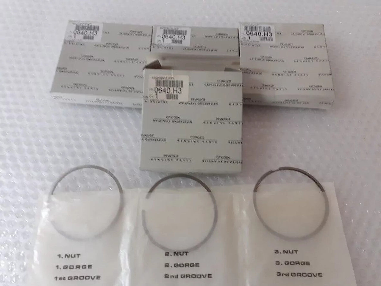 4x Piston Rings Set fits Peugeot Citroen TUD5 0640H3 Genuine View Front