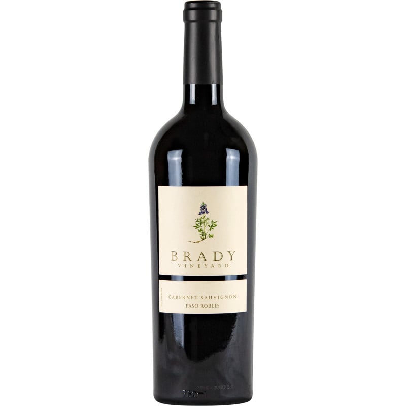 The Brady family vineyard is the family’s dream, come to realization here in Paso Robles, California. Native lupines found on the vineyard property are reminiscent of the fields of bluebonnets that greet the spring in the Brady’s native Texas. Nestled in the Estrella Valley, Brady Vineyard is just far enough inland from the Pacific Ocean to build heat daily, but still close enough to enjoy the nightly cooling of maritime breezes. Established in 2001, the 24-acre site is ideally situated for world-class viticulture, with vines rooted in the gravelly soils that form a rolling alluvial terrace overlooking the Estrella River. Here, Cabernet Sauvignon, Cabernet Franc, and Petite Sirah vines are planted at a density of 908 vines per acre, grafted onto rootstock and bred to seek out available water and nutrients in the sparse ground. Because of the inherent poverty of the site yields are limited to a scant 4 tons per acre, boosting intensity and concentration from the vines.  All of these elements together result in rich, fully-ripened grapes, ideal for producing big and bold Paso Robles red wines.