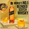 Indulge in the unmistakably big-tasting and vibrant Johnnie Walker Black Label Blended Scotch Whisky, full of flavor with the volume turned up. Each sip bursts with layers of smooth and delicious big flavors all proudly on show - creamy toffee, rich, sweet fruit and spicy vanilla, all perfectly wrapped in sweet smoke. Expertly crafted by the world's most experienced whisky makers, this blend brings together 29+ whiskies matured for at least 12 years to create the symphony of smooth and delicious flavors of Johnnie Walker Black Label. Johnnie Walker Black Label is an incredibly smooth balance of big flavors, where no matter how loud one note is, it never drowns another one out, making it a premium choice for any occasion. Includes one 80 proof 1.0 L bottle of Black Label Blended Scotch Whisky. Please drink responsibly., One 1 L bottle of Johnnie Walker Black Label Blended Scotch Whisky, Indulge in the unmistakable taste of Johnnie Walker Black Label, a vibrant Blended Scotch Whisky that won Gold at the San Francisco World Spirits Competition in 2024, 80 proof, This award-winning Scotch Whisky is an impressive gift that captures the essence of smooth and smoky whiskies. The perfect gift for any tasting occasion, Only the finest Scotch Whiskies, aged for no less than 12 years, are carefully blended to achieve the perfect intensity and depth of flavor, With a perfectly balanced and distinctive flavor profile, Black Label is an excellent choice whether you prefer sipping it neat, mixing it in classic cocktails such as Whisky Sour, or creating refreshing-tasting highballs, One of the worldâ€™s best-selling deluxe Scotch whiskies, Layers of smooth and delicious big flavor await in every sip of Johnnie Walker Black Label, featuring creamy toffee, rich sweet fruits, and a touch of spicy vanilla, all wrapped in a sweet smoky finish