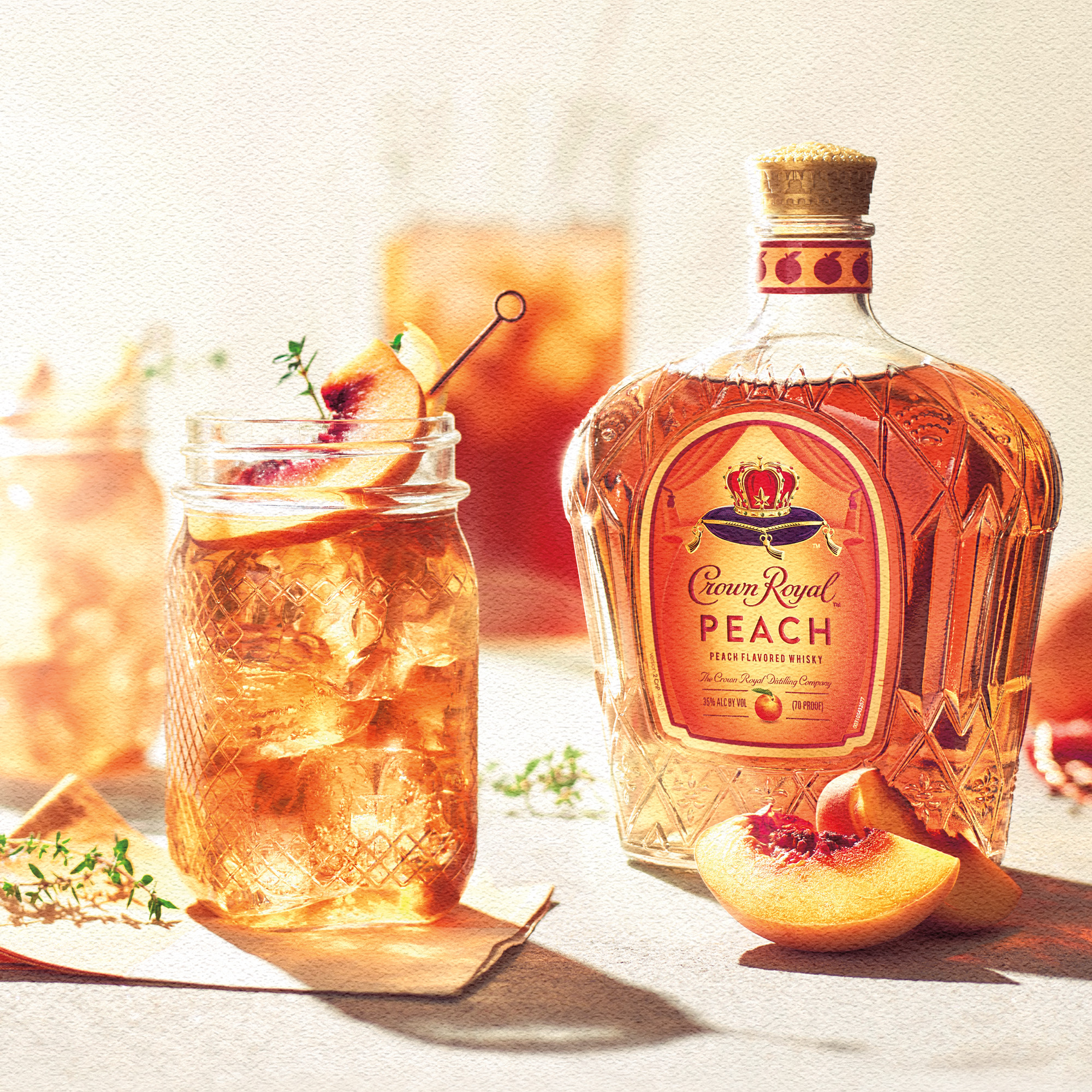 Unwind in luxury with a glass of Crown Royal Peach Flavored Whisky. To create this extraordinary blend, fresh Georgia peaches are harvested, de-stoned, pressed and strained to preserve their bright, aromatic taste. Then, our master blender infuses the juicy flavor for a vibrant and delicious whisky with luscious notes of creamy vanilla and a decadently sweet finish. Made with the signature smoothness of traditional Crown Royal, our peach flavored whisky will enhance a cozy cocktail party or rooftop celebration. Perfect for a Royal Peach Fizz cocktail. Includes one 70 proof 1.75 L bottle of Crown Royal Peach Flavored Whisky. Please drink responsibly., One 1.75 L bottle of Crown Royal Peach Flavored Whisky, Perfect for kicking off spring and summer parties, Meticulously blended with 50 distinct and rich whiskies, Infused with the juicy flavor of fresh Georgia peaches, Sweet and smooth finish