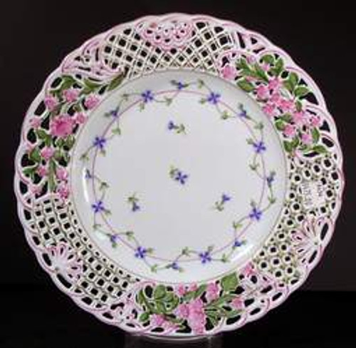 Herend Blue Garland Pierced Plate featuring delicate floral garlands, hand-painted blossoms, and an ornate reticulated rim. A collectible and retired piece of fine porcelain.