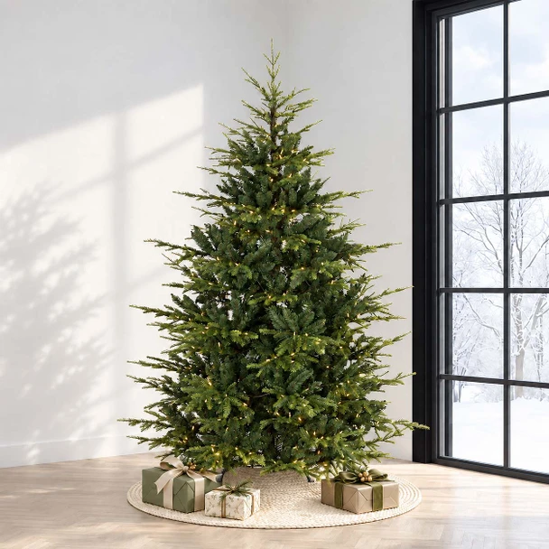 Western Balsam artificial Christmas tree with clear lights in a bright living room