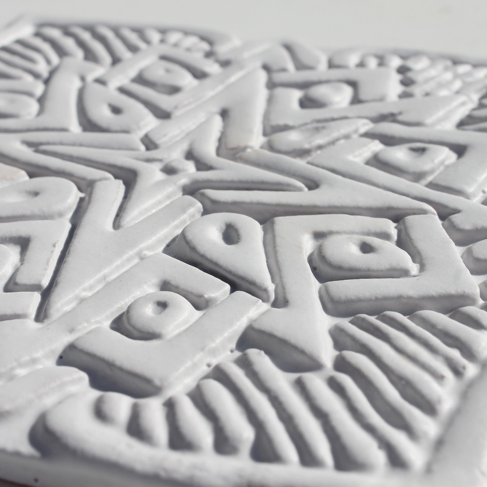 These handmade tiles make wonderful kitchen tiles, bathroom tiles, wall decor and outdoor wall art.  White relief tile handmade in Spain.