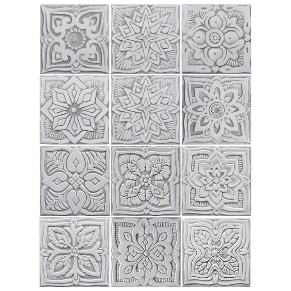 These handmade tiles make wonderful kitchen tiles, bathroom tiles, wall hangings and outdoor wall art.  Grey & white relief tile handmade in Spain.