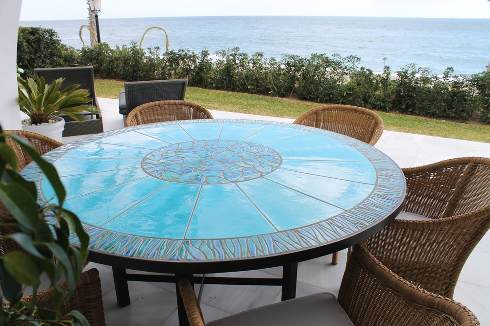 Mosaic table made from Handmade tiles.  Custom designed ceramic table, handmade in Spain.
