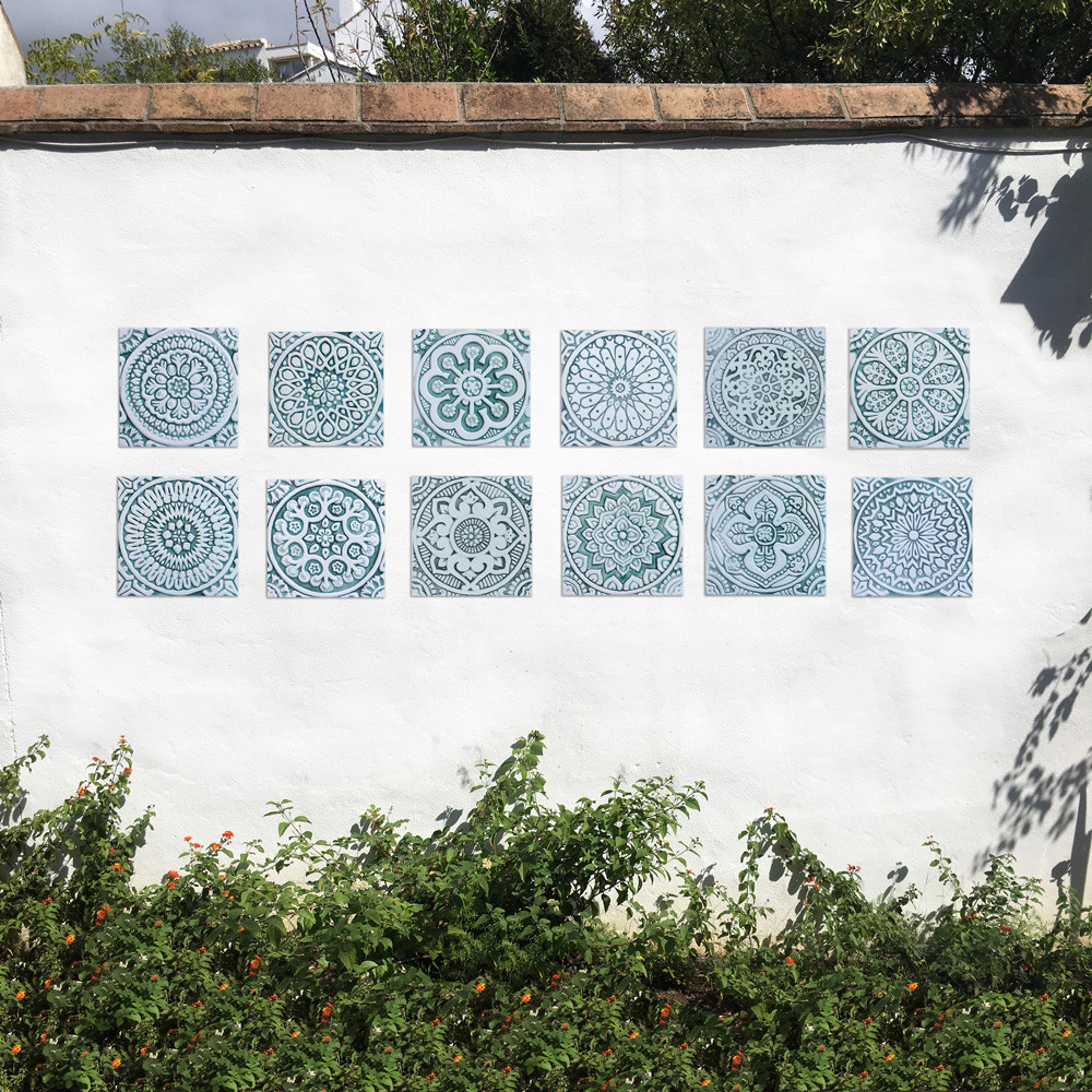 Handmade tile for kitchens, bathrooms and outdoor wall art. Decorative tile handmade in Spain. Relief tile glazed in aqua and white.
