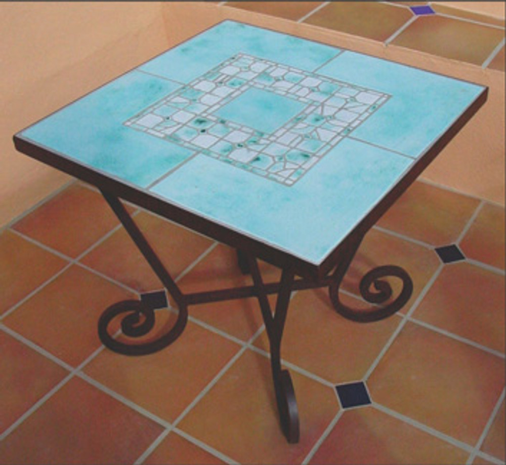 Mosaic table made from Handmade tiles.  Custom designed ceramic table, handmade in Spain.