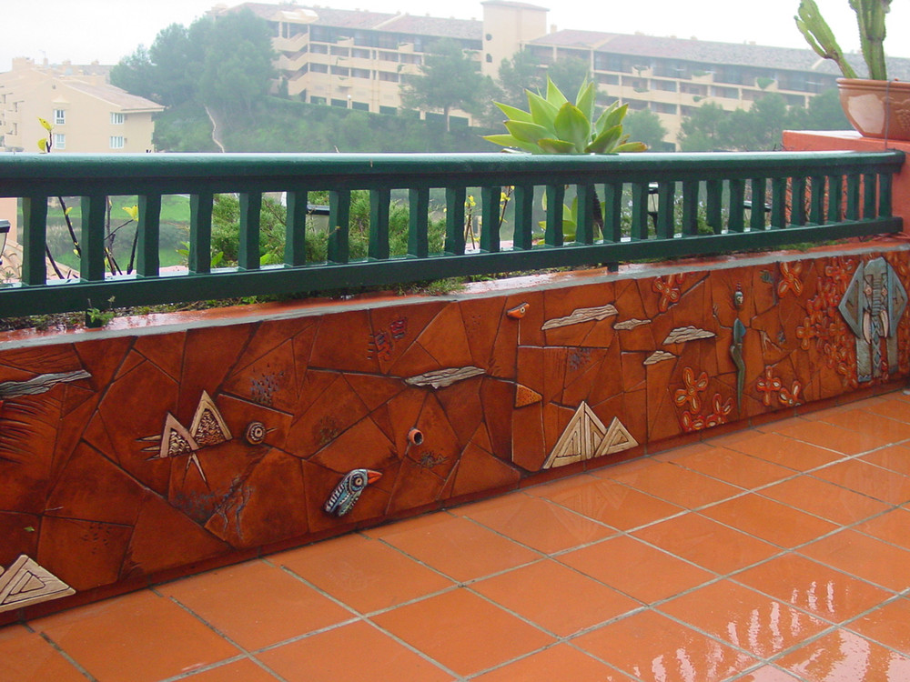 Ceramic mural made with Handmade tiles.  Custom designed ceramic wall art installation, handmade in Spain.