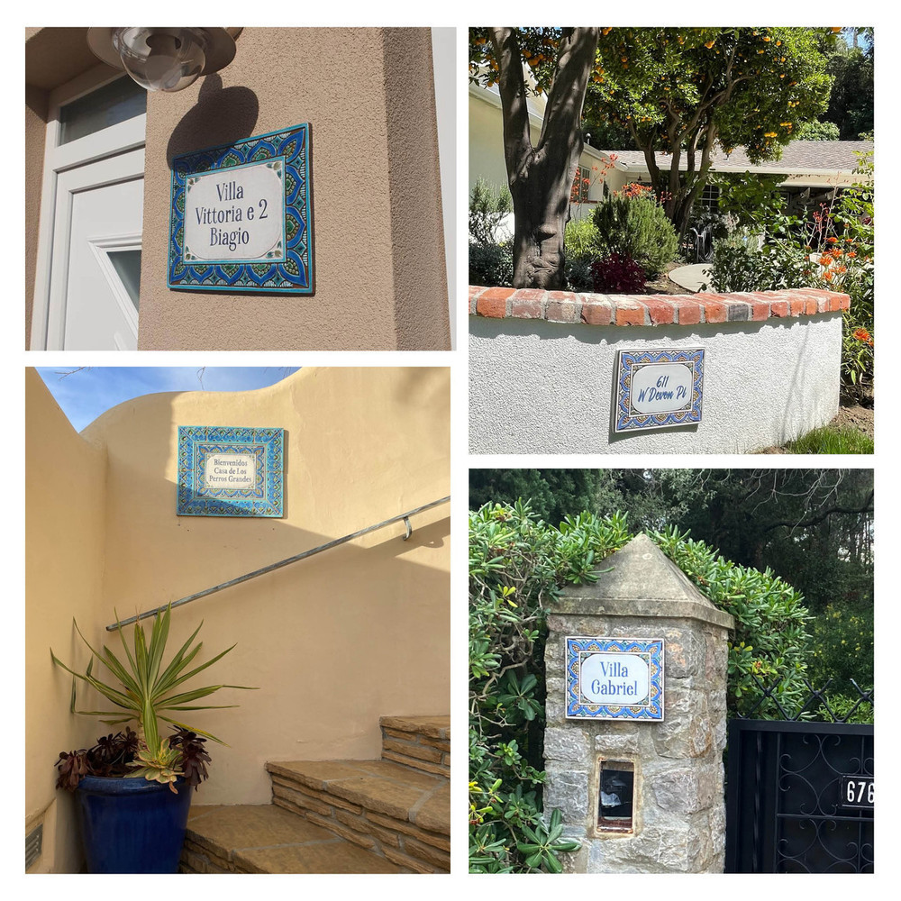 Blue and white house sign made from ceramic with petals design.