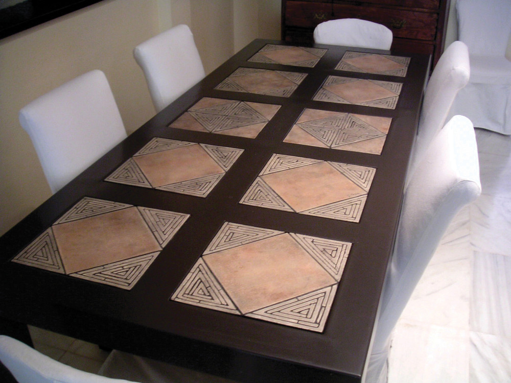 Mosaic table made from Handmade tiles.  Custom designed ceramic table, handmade in Spain.