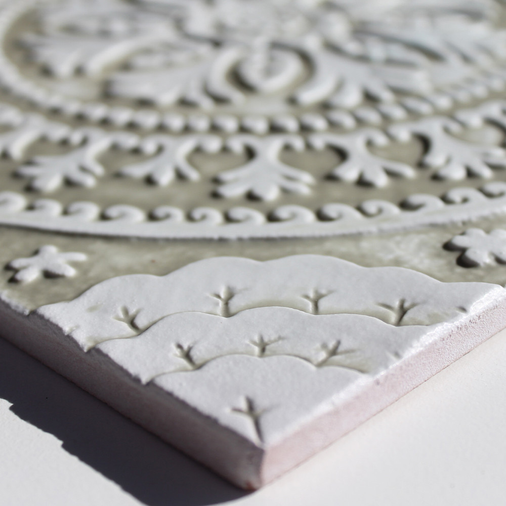 Handmade tile for kitchens, bathrooms and outdoor wall art. Decorative tile handmade in Spain. Relief tile glazed in beige and white.