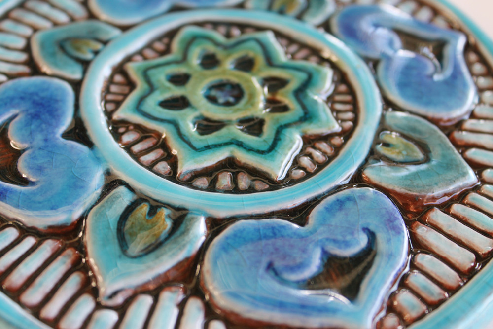 These circular handmade tiles make unique wall hangings for kitchens, bathrooms or outdoor wall art. Our turquoise decorative tiles can also be combined with our many other circular tiles to make larger wall art installations.