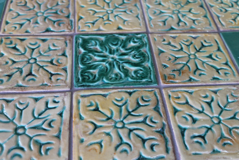 Mosaic table made from Handmade tiles.  Custom designed ceramic table, handmade in Spain.