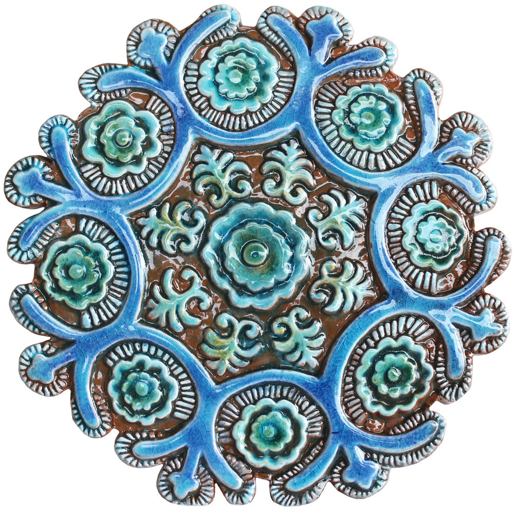 These handmade tiles make a unique wall art installation.  Our decorative tiles are glazed in turquoise and make wonderful outdoor wall art. Perfect for decorating a white wall. Circle garden decor handmade in Spain.