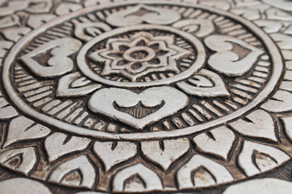 Handmade tile for outdoor wall art.  Decorative circular ceramic tile handmade in Spain