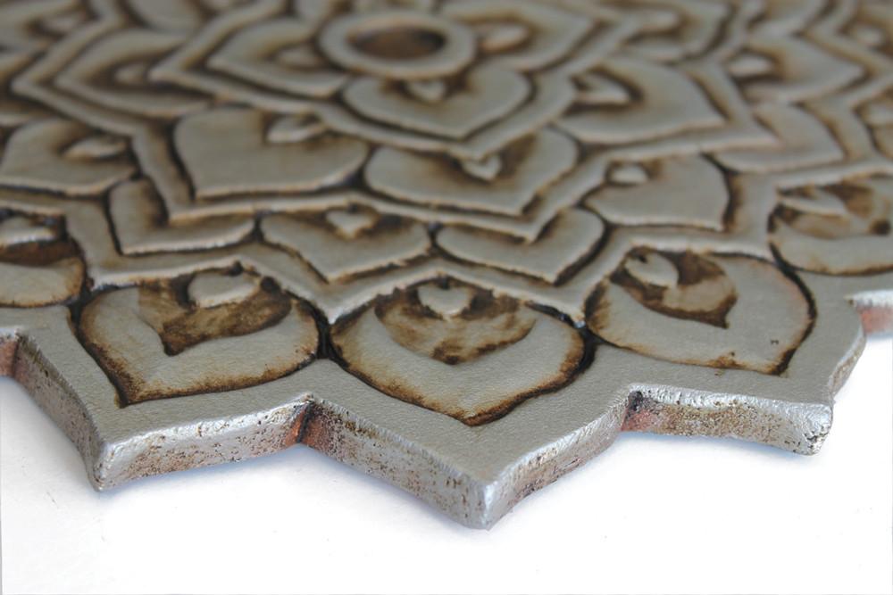 Handmade tile for outdoor wall art.  Decorative circular ceramic tile handmade in Spain