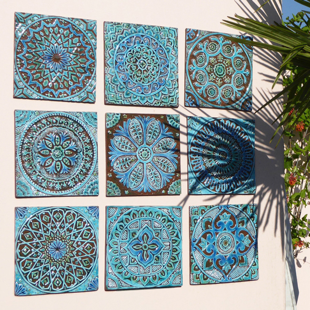 Outdoor wall art. Turquoise handmade tile with decorative relief. Large decorative tile with Suzani design.