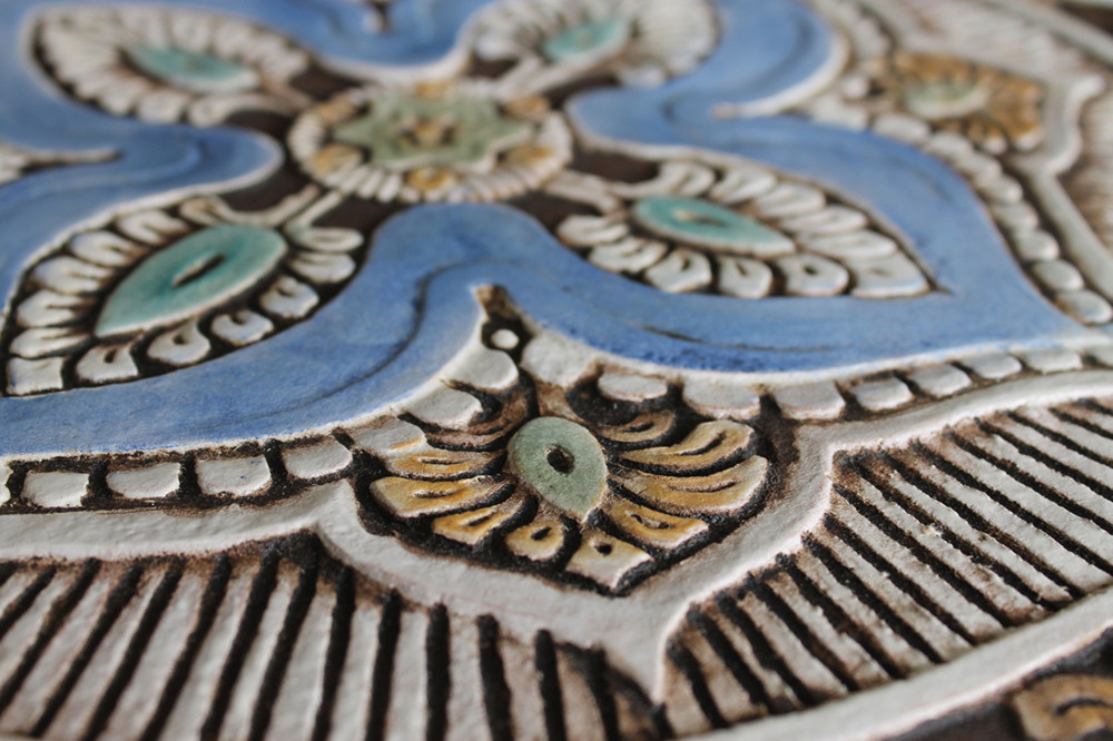 These handmade tiles make outdoor wall art.  Decorative tile handmade in Spain.