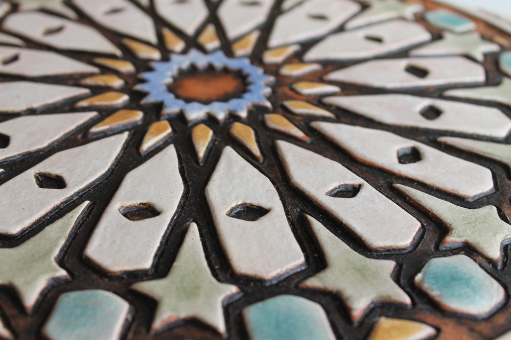 These handmade tiles make outdoor wall art.  Decorative tile handmade in Spain.