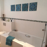 Ceramic wall art installation with Handmade tiles.  Decorative tiles used as outdoor wall art.  Spanish tile wall decor.