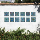 Turquoise handmade tile with decorative relief. Decorative tile handmade in Spain.