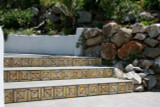 Custom handmade tiles to decorate exterior steps or risers with abstract design.