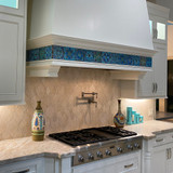 Handmade tiles used in kitchen backsplash.  Decorative turquoise tiles handmade in Spain