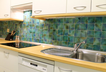 Kitchen backsplash using handmade tiles by GVega.  Handmade in Spain.
