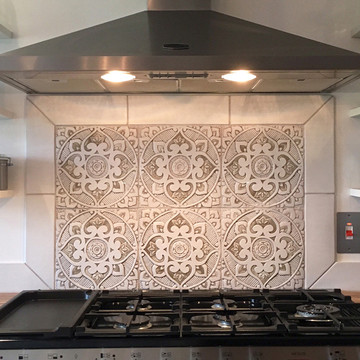 Handmade tile with carved relief for kitchens, bathrooms and outdoor wall art. Decorative tile handmade in Spain.