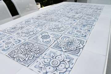 These handmade tiles make wonderful kitchen tiles, bathroom tiles, wall hangings and outdoor wall art.  Grey & white relief tile handmade in Spain.