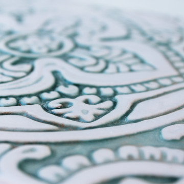 Handmade tile with carved relief for kitchens, bathrooms and outdoor wall art. Decorative tile handmade in Spain in aqua & white.