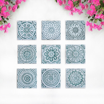 Handmade tile with carved relief for kitchens, bathrooms and outdoor wall art. Decorative tile handmade in Spain in aqua & white.