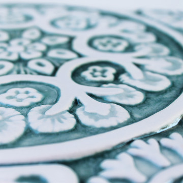 Handmade tile with carved relief for kitchens, bathrooms and outdoor wall art. Decorative tile handmade in Spain in aqua & white.