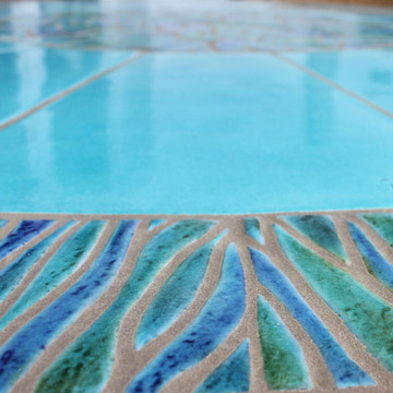 Mosaic table made from Handmade tiles.  Custom designed ceramic table, handmade in Spain.