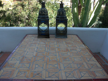 Mosaic table made from Handmade tiles.  Custom designed ceramic table, handmade in Spain.