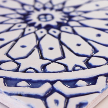 Blue and white handmade tile with relief for kitchens bathrooms and outdoor wall art. Decorative tile handmade in Spain.