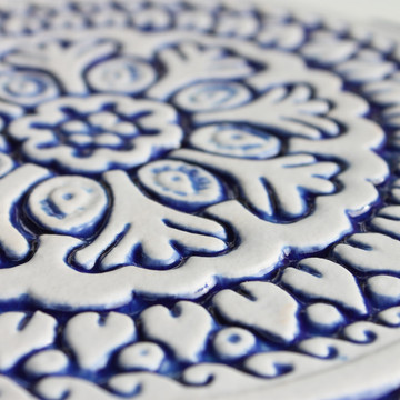 Blue and white handmade tile with relief for kitchens bathrooms and outdoor wall art. Decorative tile handmade in Spain.